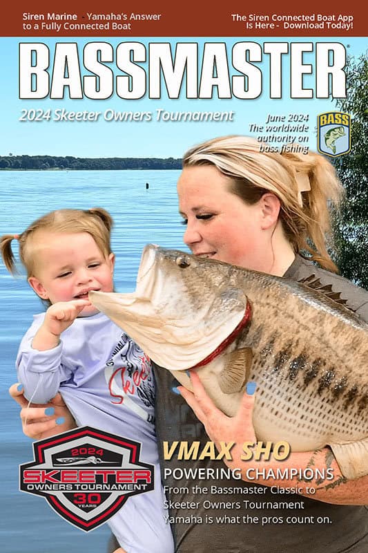 a participant poses with her daughter on the cover of Bassmaster Magazine for this Dallas Green Screen Photo Booth for Skeeter Boats